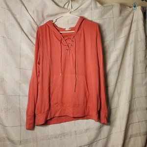 Coral hoodie with lace up neck, built in mask, pocket pouch size Large.